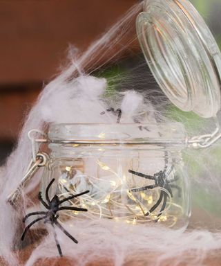 microlights in jar with faux spiderwebs
