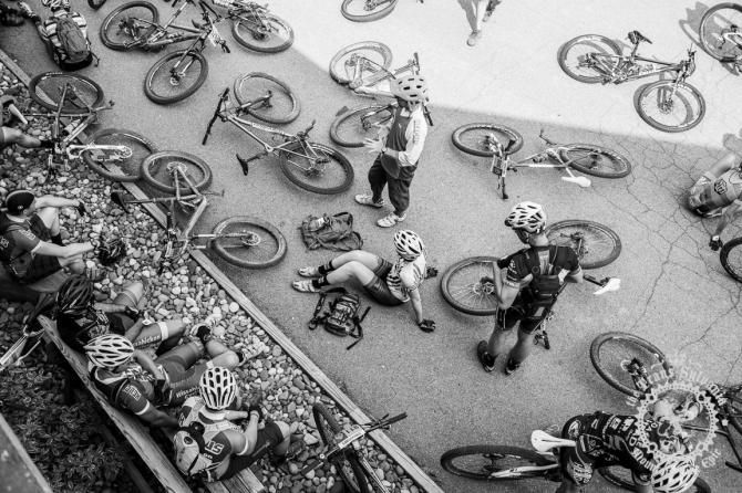 Bikes lay on the parking lot during the prerace meeting for the Enduro stage