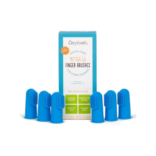 Oxyfresh Super Soft BPA-Free Silicone Dog & Cat Finger Brushes (6 pack) next to the packaging, one of the best toothbrushes for dogs