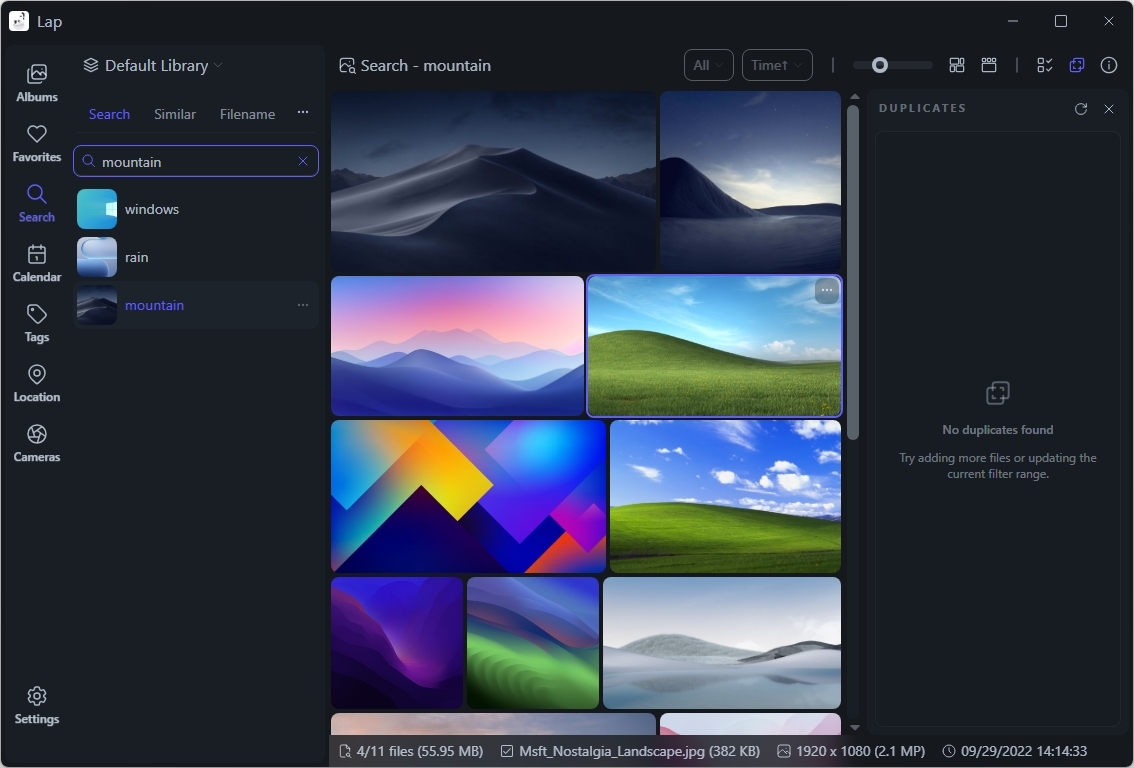 Dark-themed user interface of a digital library shows a search for "mountain" with colorful mountain images in various artistic styles.