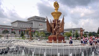 School children on a field trip play by a fountain at the Kumsusan Memorial Palace Of The Sun (mausoleum of Kim Il Sung and Kim Jong Il). A palatial structure where the two leaders lay in state, and each has a museum dedicated to them.