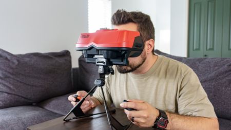 A person playing Virtual Boy on the Switch 2 using Nintendo's new accessory