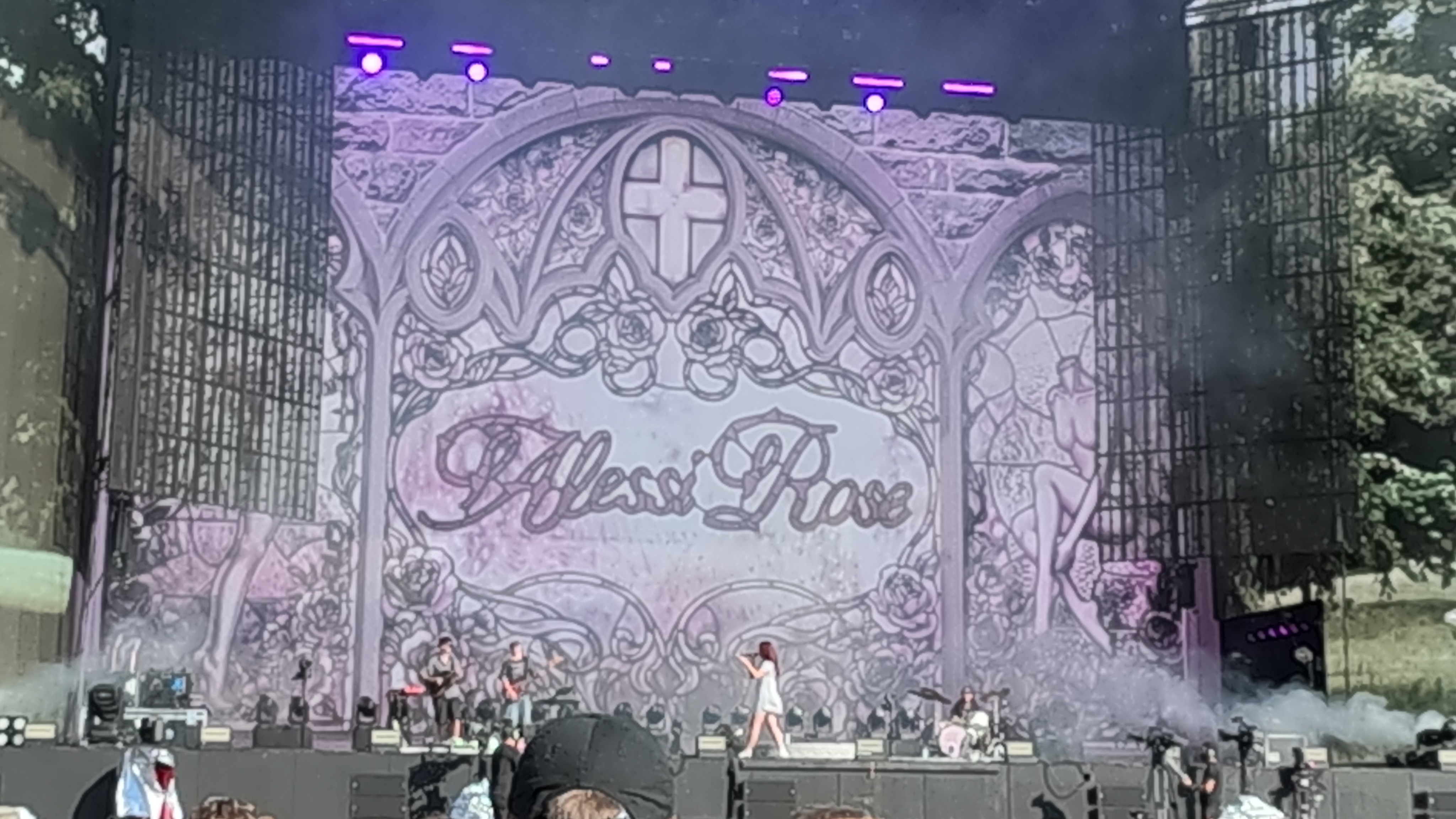 An Alessi rose concert stage with a crowd gathered in front.