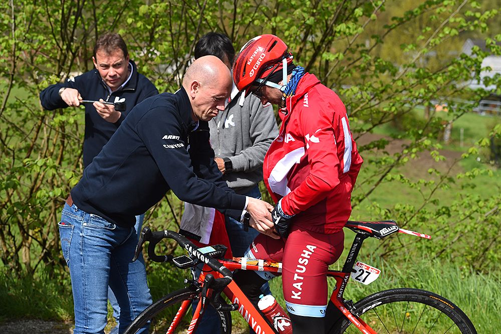 Katusha's Angel Vicioso gets assistance from his team