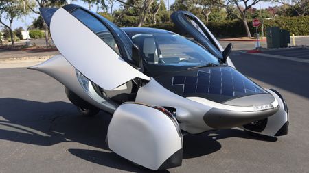 Electric car with solar panels on the hood.