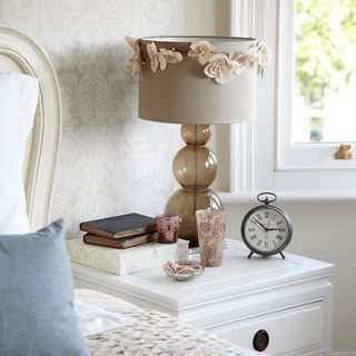 bedroom with bedside table and lamp