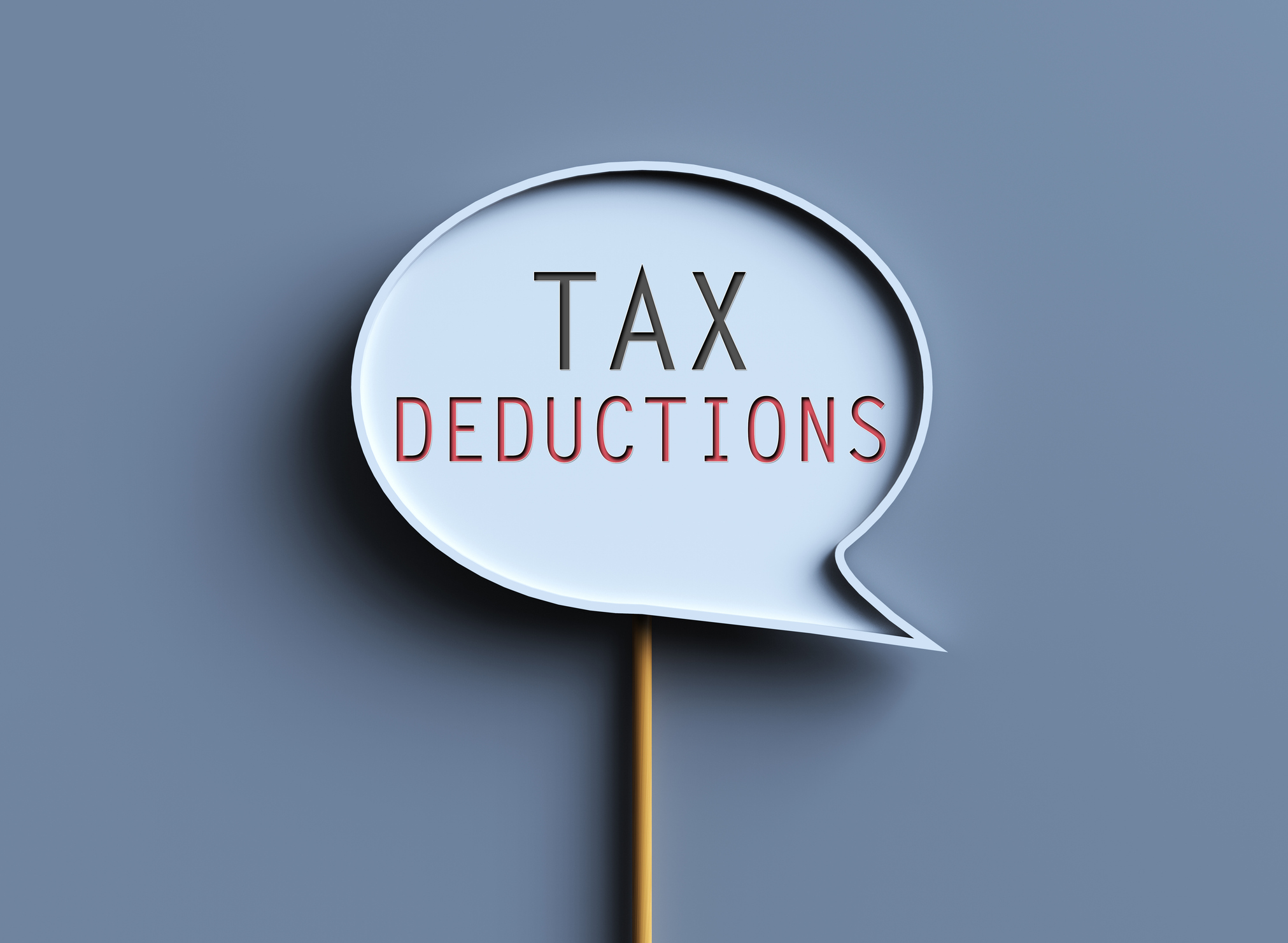 speech bubble that says &quot;tax deductions&quot; on a blue-gray background