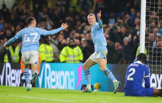 Erling Haaland of Manchester City celebrates with Phil Foden after scoring his side's third goal during the Premier League match between Chelsea FC and Manchester City at Stamford Bridge on November 12, 2023 in London, England. (Photo by James Gill - Danehouse/Getty Images)