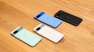 Google Pixel 8a in all four colors on table.