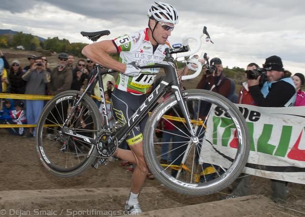 Trebon decides it quicker to carry his bike up the stairs