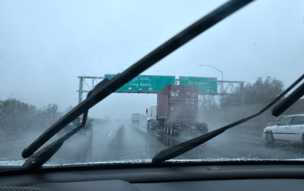 Car in Southern California plunges through a rainstorm.