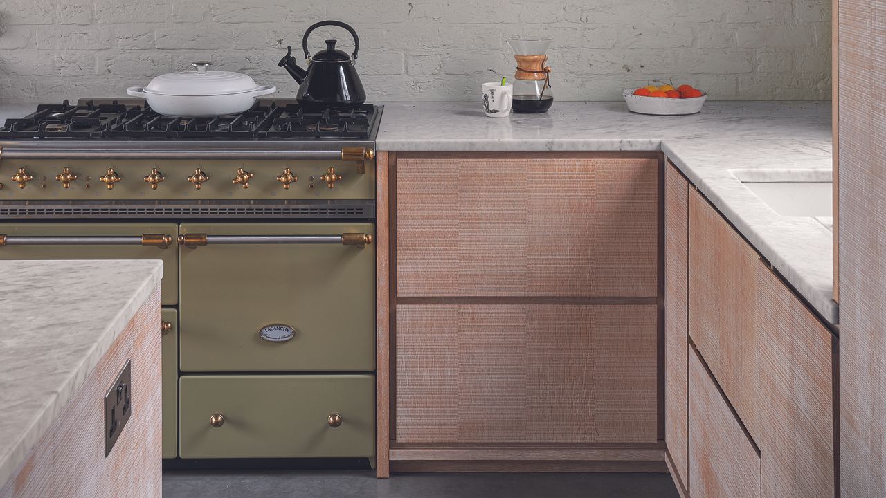 Light oak kitchen with olive green range cooker