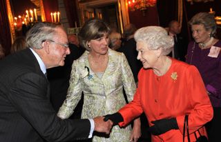 Queen Elizabeth II meets guests at St James's Palace for a Friends of the Elderly reception on November 2, 2009