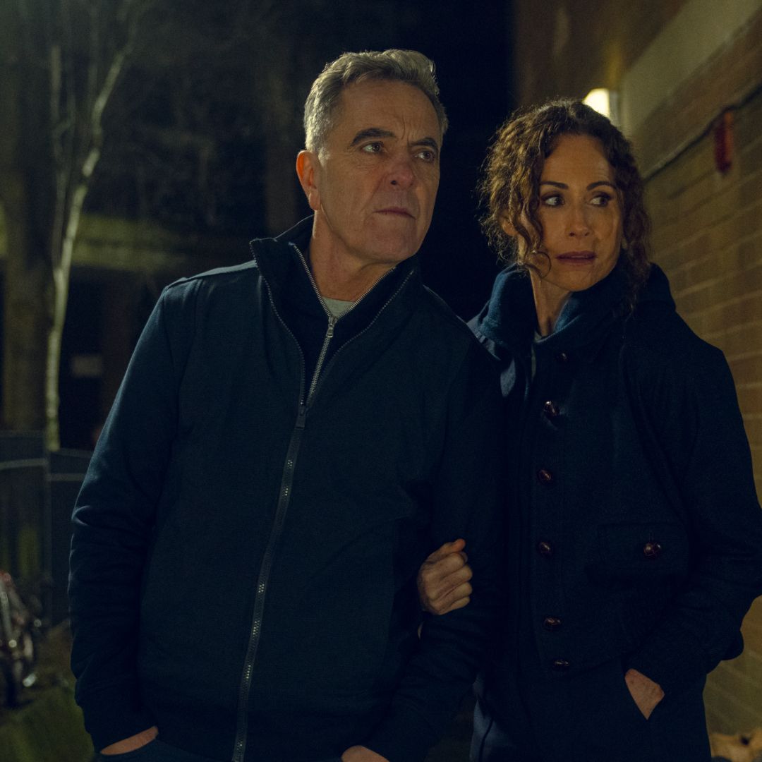 james nesbitt as simon and minnie driver as ingrid wearing all black sneaking around a building investigating in a scene from harlan coben's run away