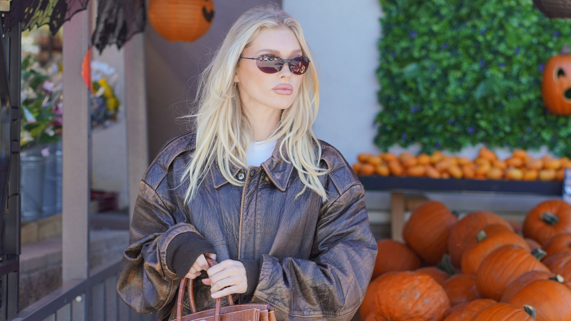 Elsa Hosk wears a leather bomber jacket