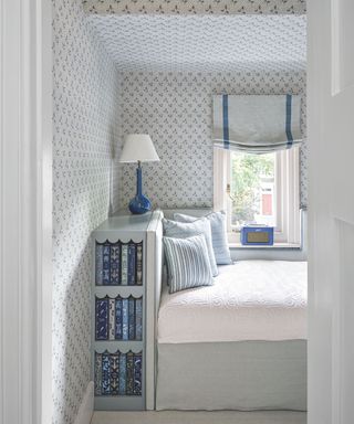 small bedroom with inbuilt book shelf in bedframe