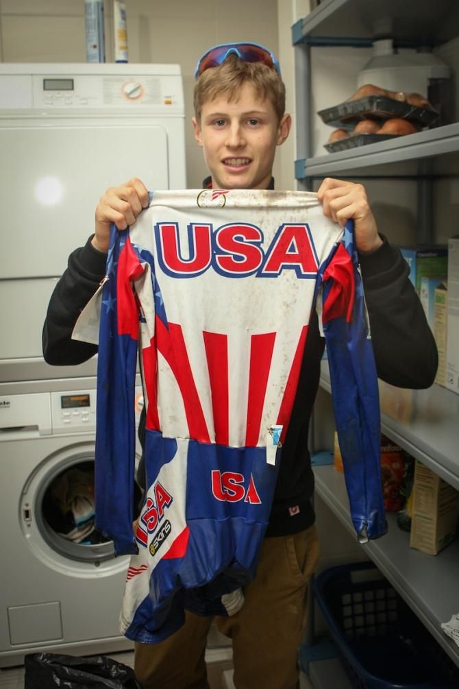 Lance Haidet shows off his clean USA skin suit in the house laundry room.