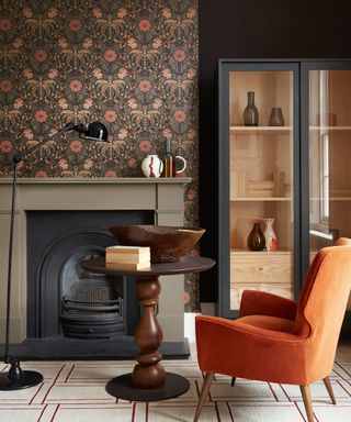 living room with black and brown color scheme, orange chair