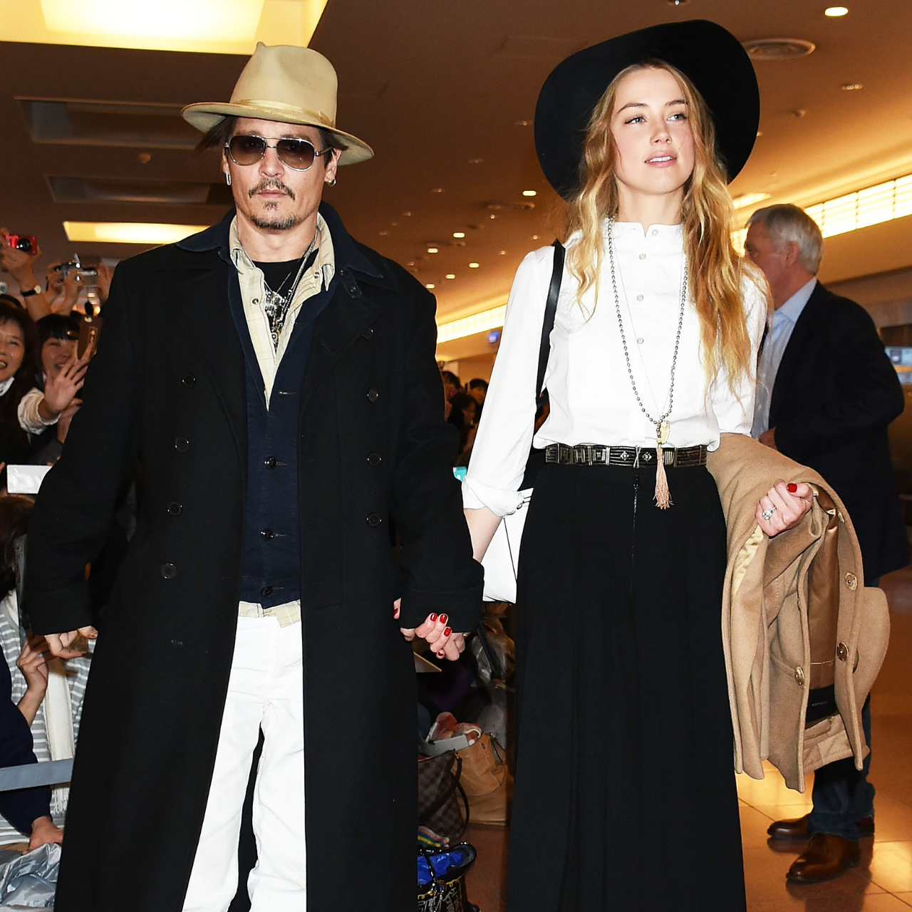 Johnny Depp and Amber Heard arrive at the Haneda airport in Tokyo, Japan 2015