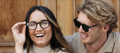 A woman with eyeglasses and a man with sunglasses