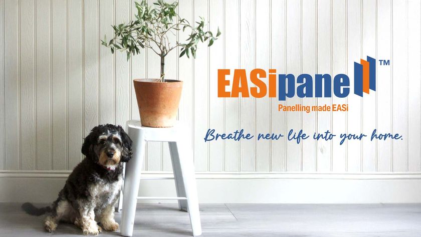 A tongue and groove-clad wall painted in white, with a dog and a flower pot in front. The EASipanel logo is displayed against the wall