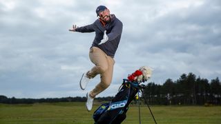 Peter Finch jumping over a golf bag