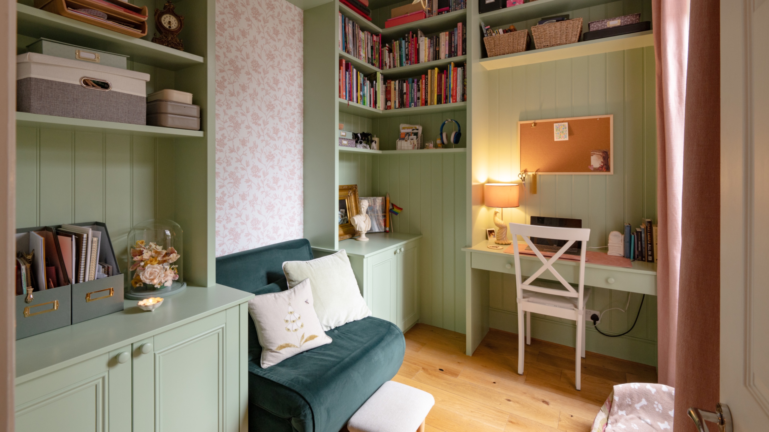 green bespoke made home office with sofa bed, storage and desk