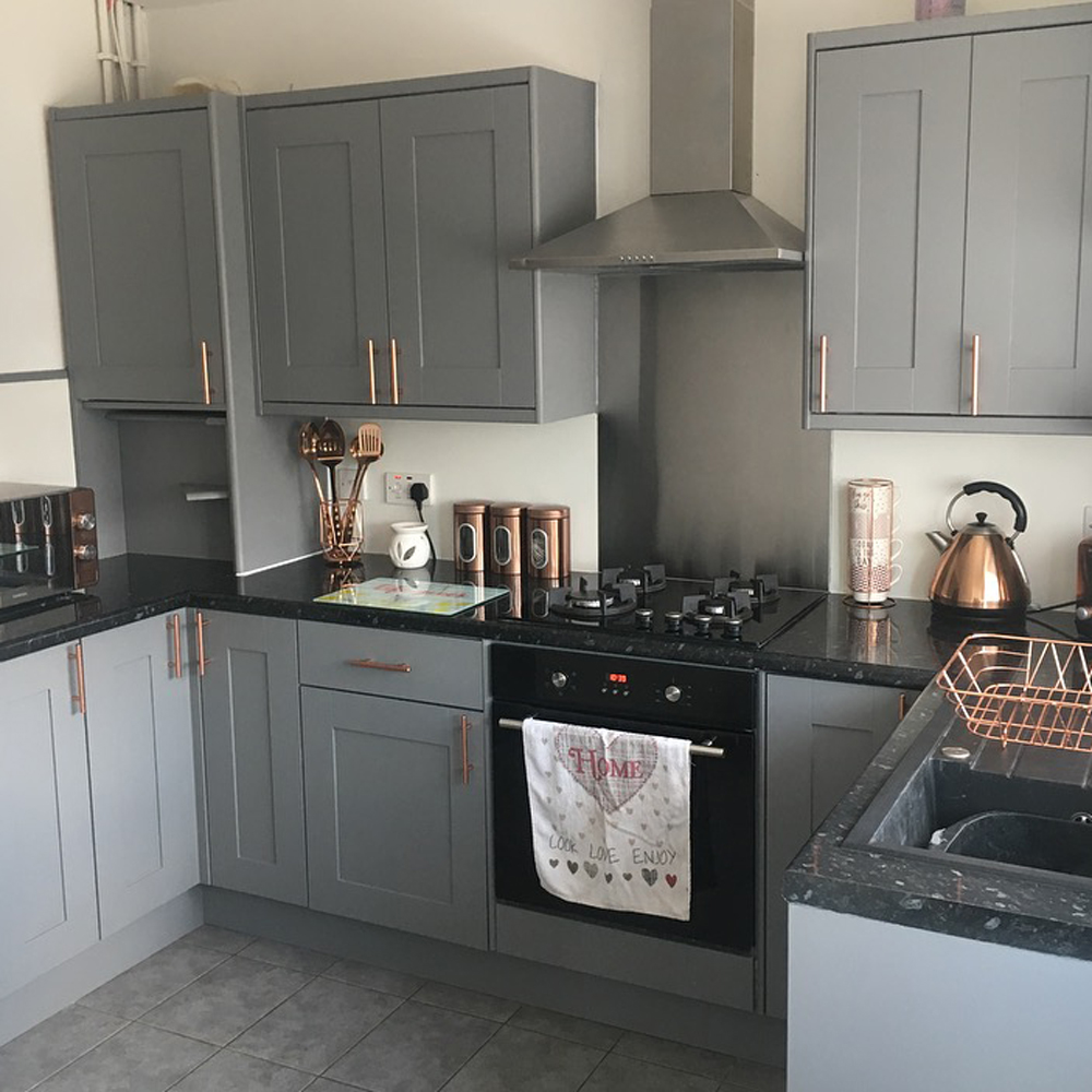 kitchen with grey cabinets and granite counter top