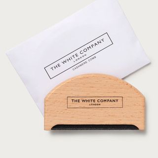 A cutout of The White Company wooden cashmere comb