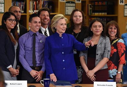 Hillary Clinton and participants at a roundtable in Las Vegas.