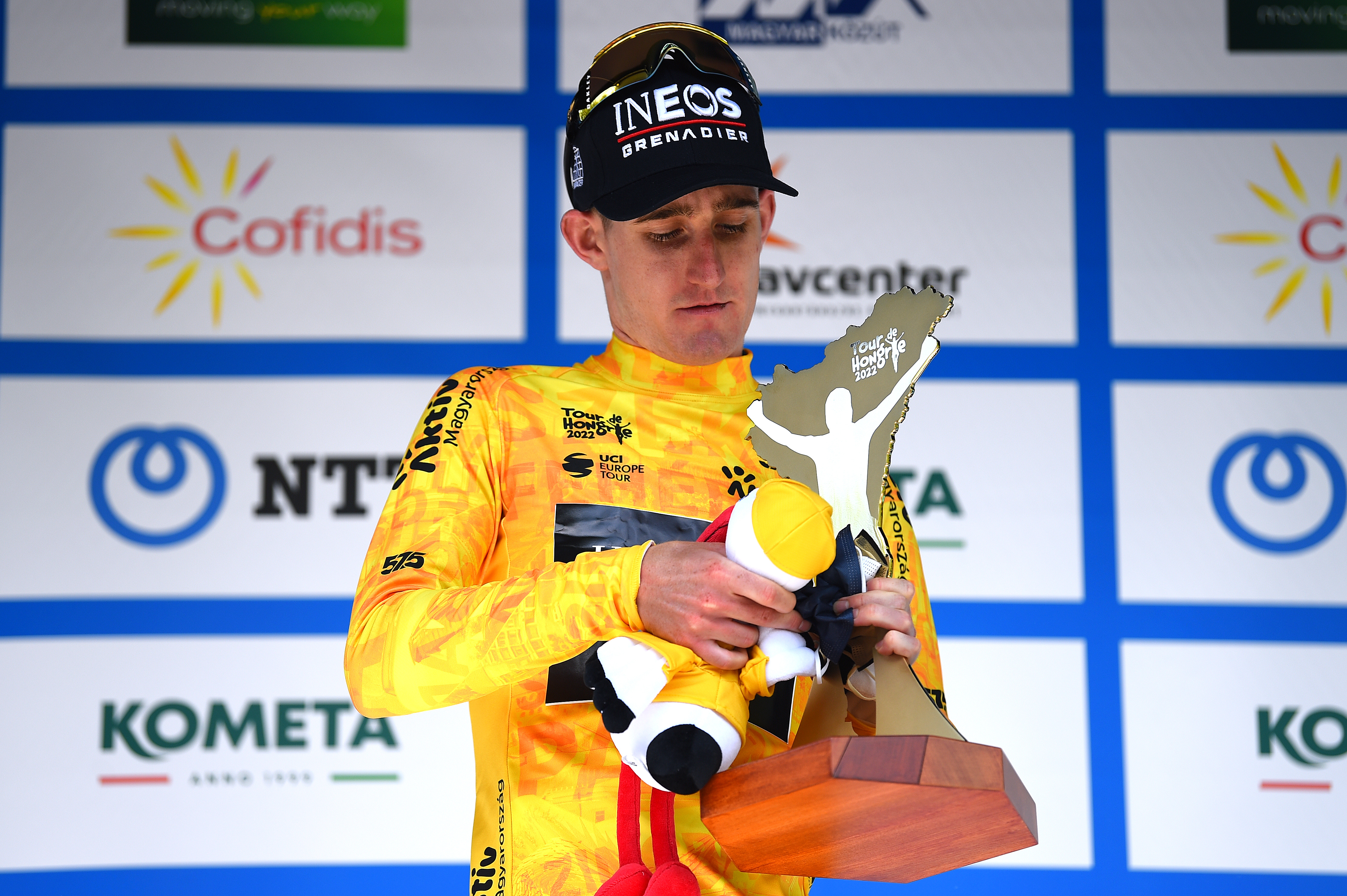 Eddie Dunbar wins the overall at the Tour de Hongrie, poses with trophy on podium
