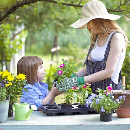 Mother and daughter garden together