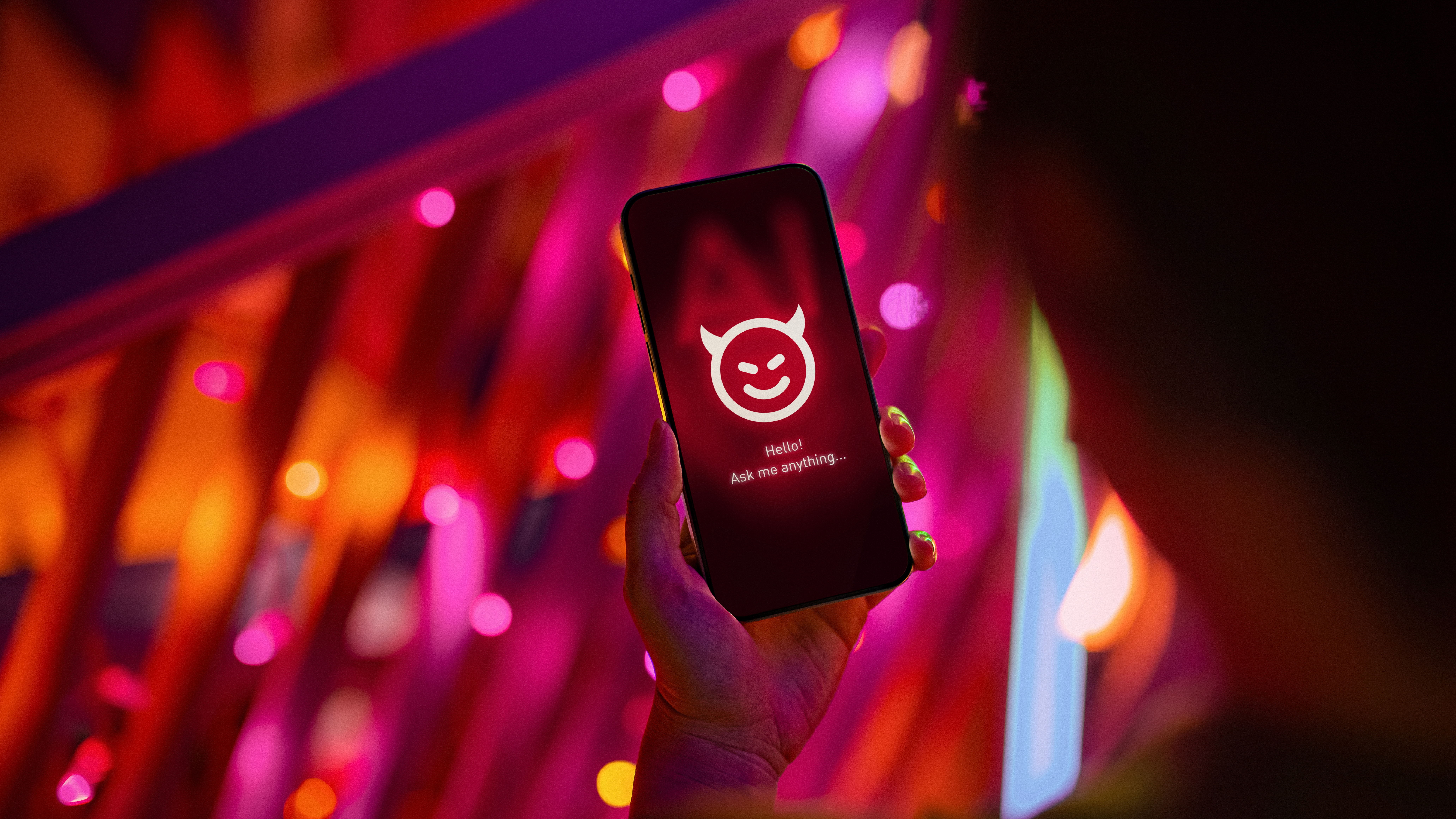 A mobile phone with an evil AI icon on the screen.