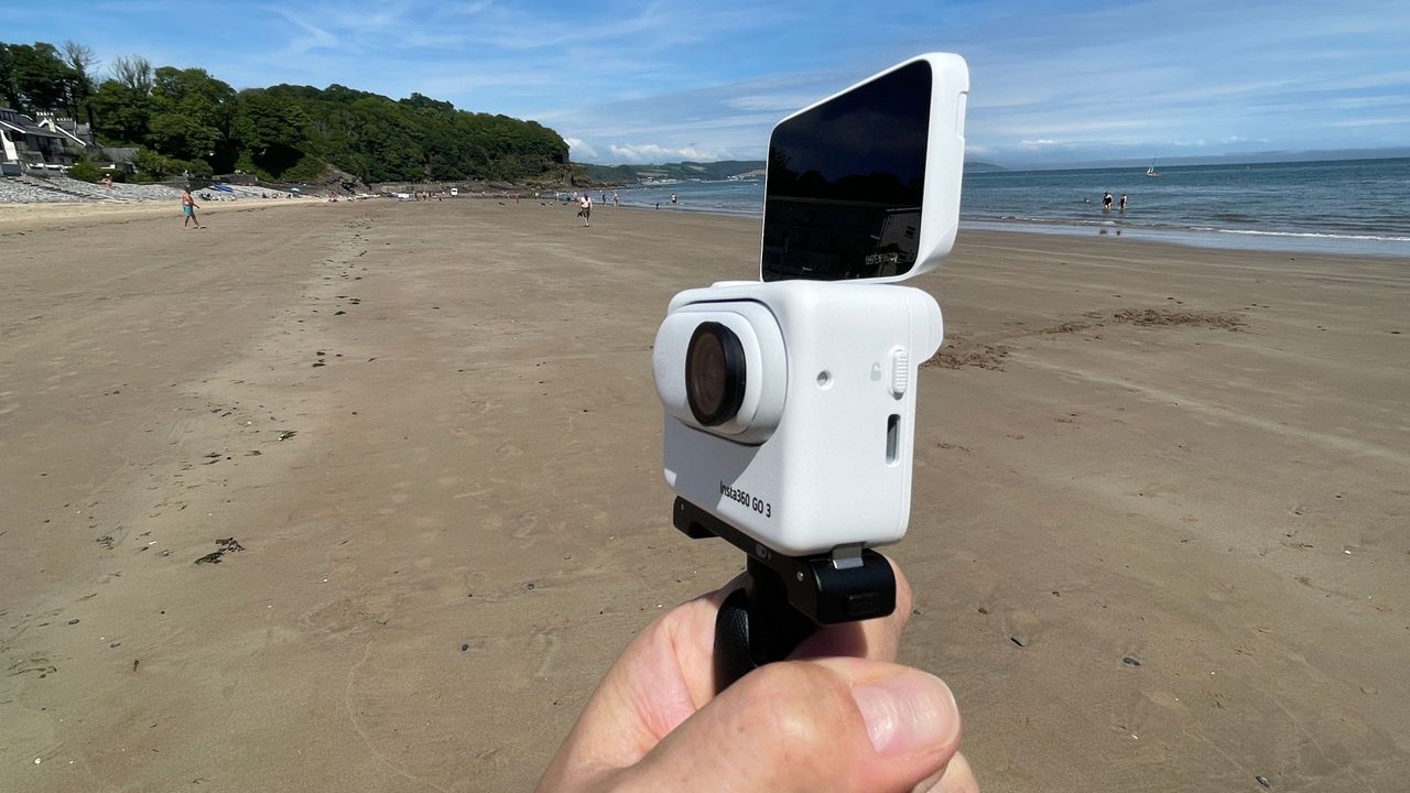 Insta360 GO 3 action camera on a beach