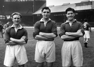 Bobby Smith (centre) alongside Chelsea team-mates E Parsons (left) and J McNicol (right) in August 1953.