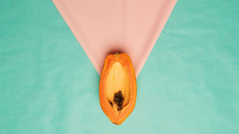 papaya on blue and pink background