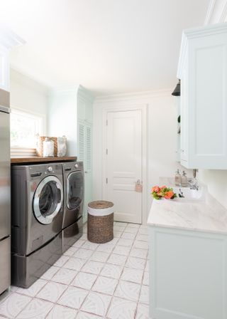 how to organize a laundry room with image by Kim Armstrong Design