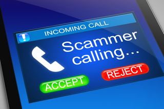 "Scammer calling" message on a smartphone screen