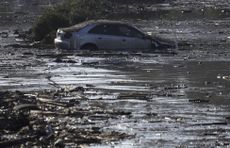A car sits in flooded water in Montecito, California.