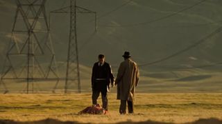 Brad Pitt and Morgan Freeman stand in the desert at the end of Seven