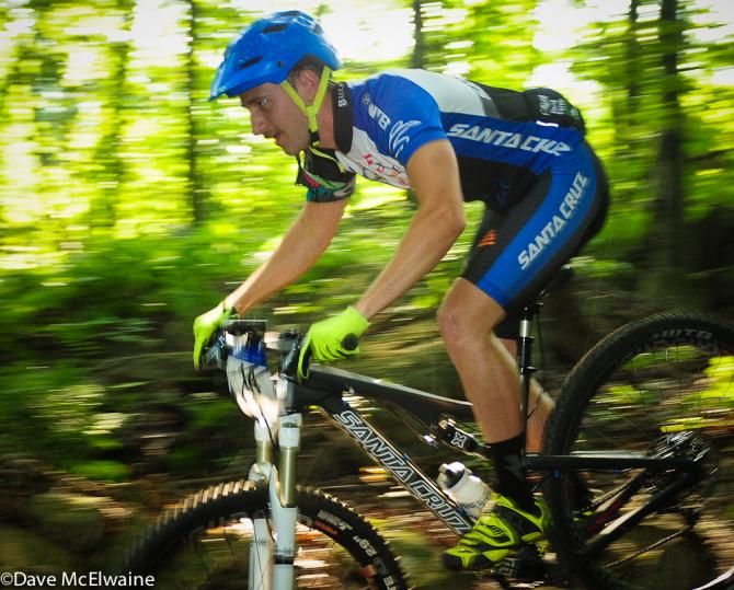 A Santa Cruz rider streaking through the woods at Bear Creek Resort