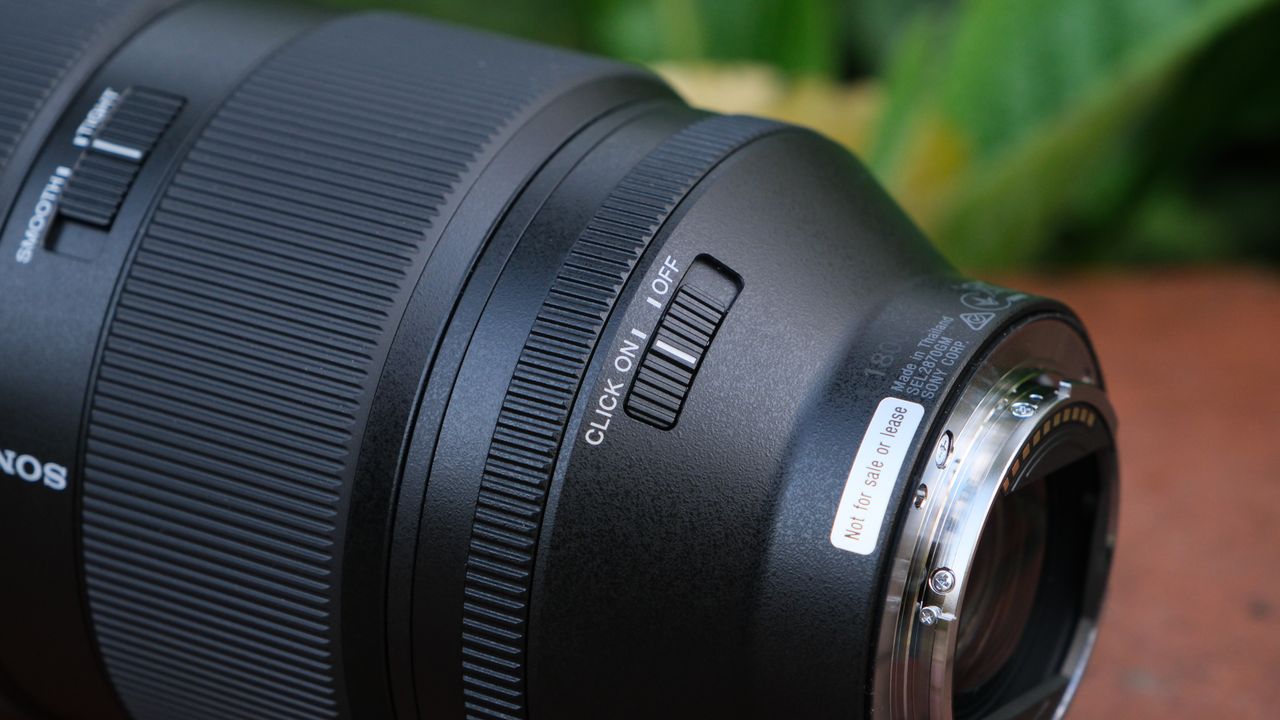 Close-up of the click on off switch on a Sony FE 28-70mm f/2 GM lens
