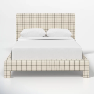 patterned upholstered bed frame with green checkered print