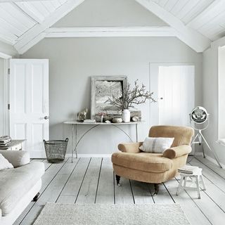 Living room with white walls and wooden flooring