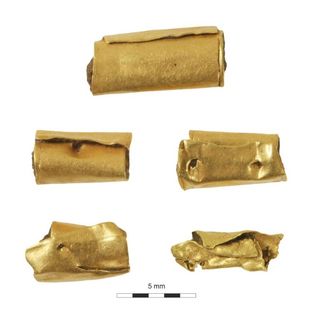 The gold beads found in the ancient woman's grave