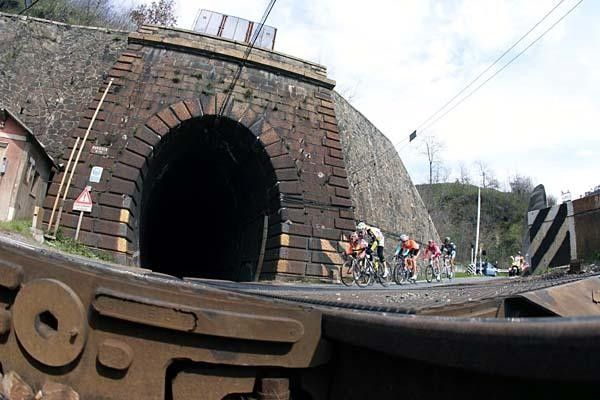 The day's breakaway group negotiate a railway crossing.