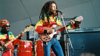 Aston 'Family Man' Barrett and Bob Marley perform on stage at Crystal Palace Bowl on June 7th, 1980 in London.