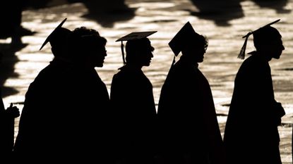 Graduates arrive for the commencement ceremony at the University of Maryland.