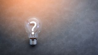 A question mark inside a lightbulb