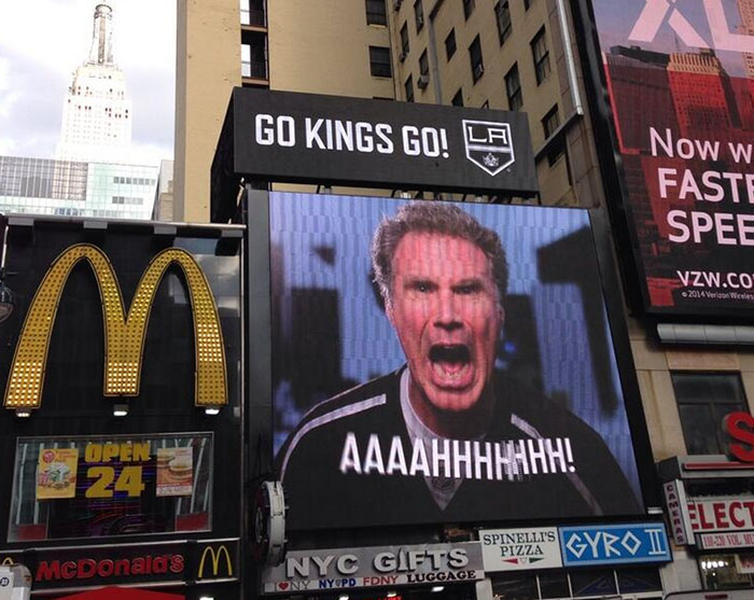 A giant sign featuring Will Ferrell shouting 'Go Kings, Go